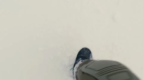 Man Taking a Walk on Snow An Engaging Top Down View Perspective Stock Footage 316296748