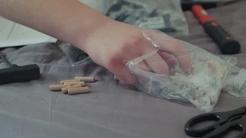 Man Taking Wardrobe Hardware Part From Bag Stock Footage 338375033