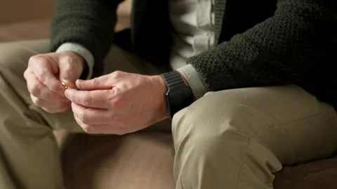 A man taking off wedding ring for separation counselling, cheating or mistake Stock Footage 264762629