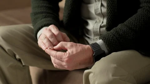 A man taking off wedding ring for separation counselling Stock Footage 264762684