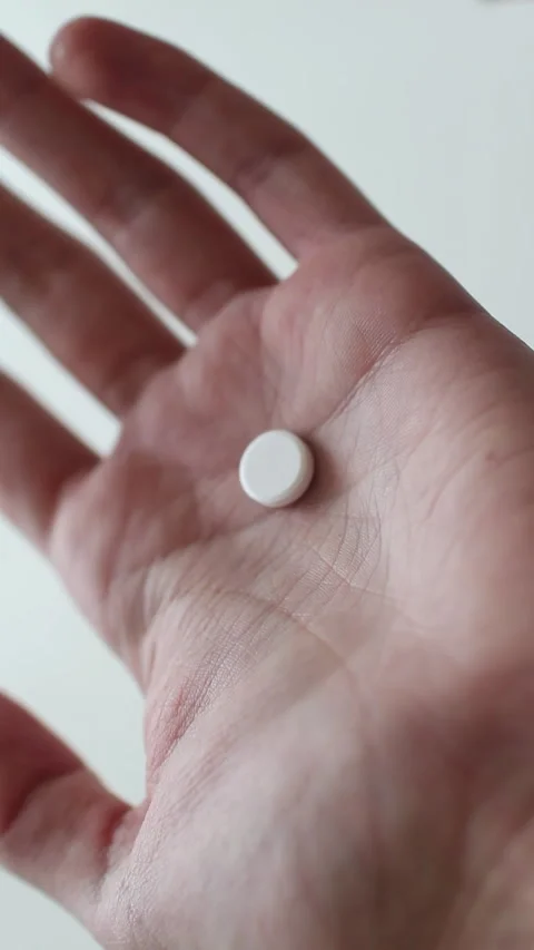 Man Taking white Pill from Blister Pack close up, healthcare and people concept. Stock Footage 270067237