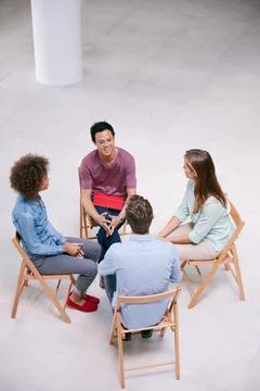 Man, talk and circle with group therapy at office, listen and support for c.. Stock Photos