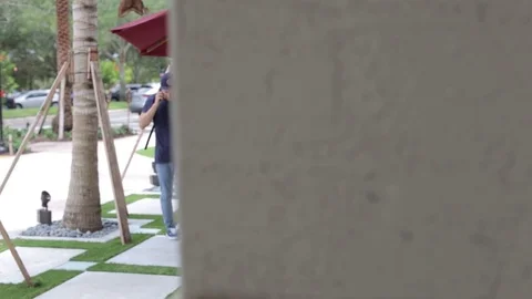 Man Talk to Client on Phone while Pacing Back and Forth Stock Footage 76484135