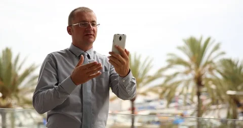 Man Talk Office Team Online Conference Mobile Phone Idyllic Vacation Palms Trees Stock Footage