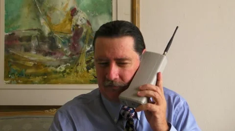 Man talking on 1980s celular phone v1 Stock Footage 5506062