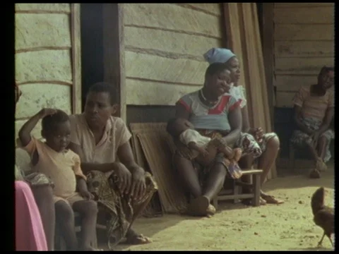 Man talking about hospital help while people making herb medicine, 1990 Video stock 136672530