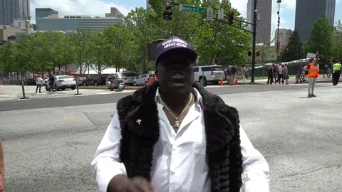 Man talking to the camera during protest in Atlanta Stock Footage 76836144