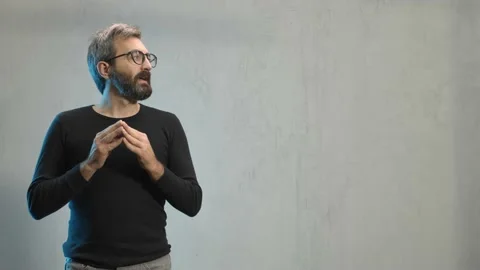 Man talking to camera, smiling, presenting, teaching to colleagues. In the back 動画素材 143261445