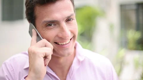 Man talking on cell phone and smiling Stock Footage 63291857