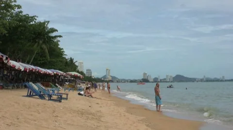 Man Talking On Cell Phone At The Beach 스톡 동영상 8778124