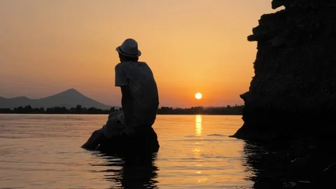 Man talking by cell phone on seascape background. New technologies and nature Stock Footage 116133205