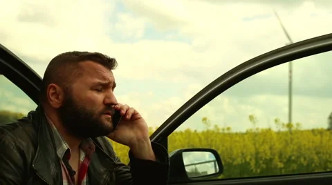 Man talking in the cell phone, sitting in car  Stock Footage 62861272