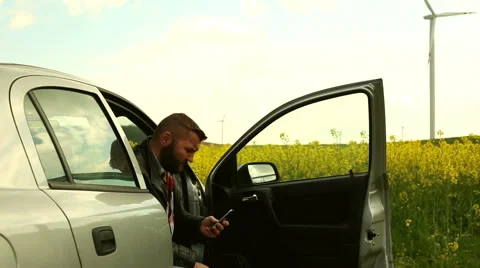 Man talking in the cell phone, sitting in car  Stock Footage 62861317