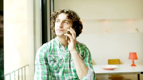Man talking on cellphone and drinking beer, steadycam shot Stock-Footage 62977970