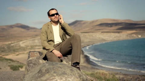 Man talking on cellphone, outdoors  Stock Footage 1055748