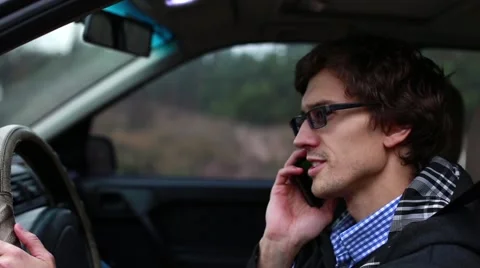 Man talking driving a car Stock Footage 62271555
