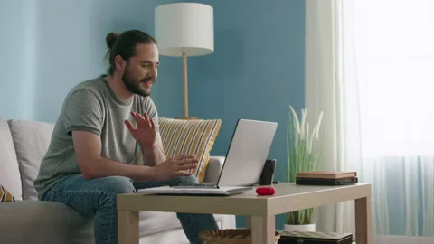 Man Is Talking with Friend via Laptop Stock Footage 130450366