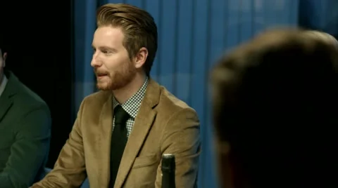 Man talking to friends at a dinner party. Stock Footage 61157546