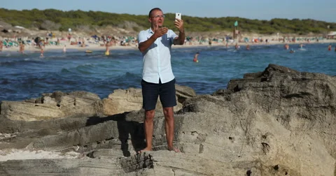 Man Talking with Friends Inviting by Mobile Phone Video Call Online Conversation Stock Footage 67869677