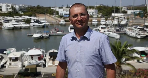 Man Talking Looking Camera Show Port Luxury Yachts Holidays Travel Destination Stock Footage 73569468