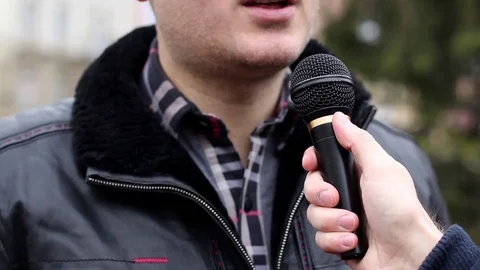 Man talking on mike Stock Footage 71152672