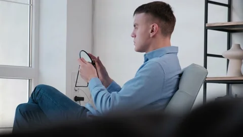 Man talking to a mirror while holding it in his hands Video stock 168638518