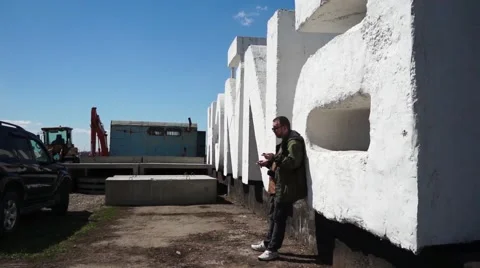 Man talking mobile on a construction site Stock Footage 50283806