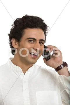 Man talking on a mobile phone and smiling Stock Photos