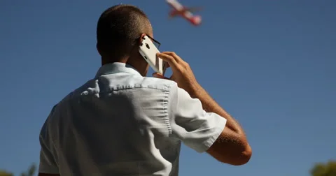 Man Talking Mobile Phone Conversation Airplane Landing Busy Business Travel Day Stock Footage 67903984