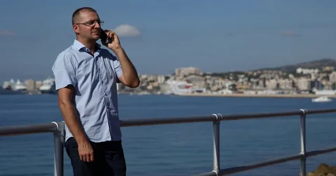 Man Talking Mobile Phone Conversation Escape Seashore Tropical Travel Vacation Video stock 80076225