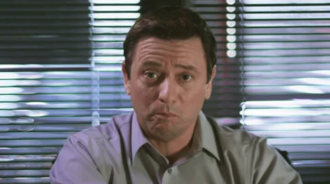 A man talking over a video chat and pointing at camera. Close up shot Vídeo Stock 33841434