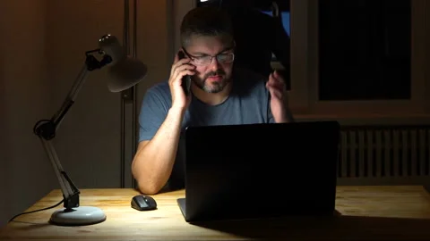 A man talking on the phone and gesturing with his hand 4K Stock Footage 130149855