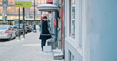 Man talking in phone booth Stock Footage 89283466