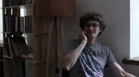 Man Talking on the Phone in a Cafe Video stock 54956003