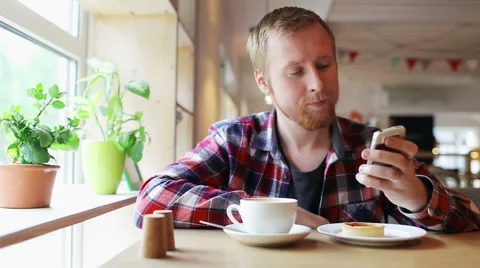 Man Talking on the Phone in a Cafe Stock Footage 65001966