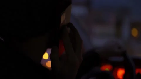 A man talking by phone during driving at night city Stock Footage 169531422
