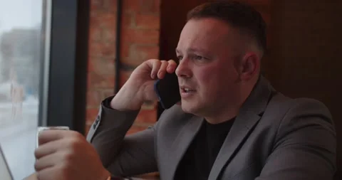 The man is talking on the phone Stock-Footage 169531878