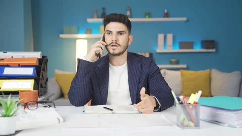 The man talking on the phone gets angry. Home office worker. Stock-Footage 237061916