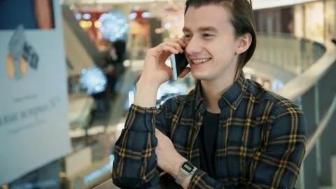 Man talking on the phone at the mall Stock Footage 70273823