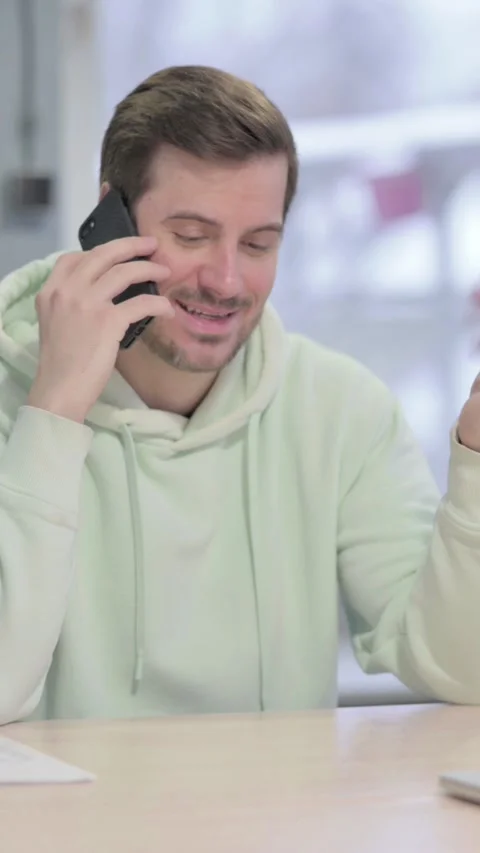 Man Talking on Phone in Office, vertical video Video stock 329105075