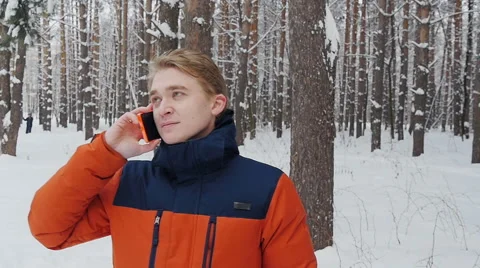 A man talking on the phone in the park slowmotion Stock Footage 59141813