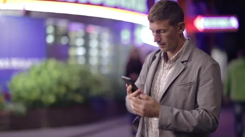 A man is talking on phone on the street Stock Footage 57850341