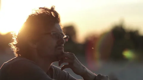 Man Talking On The Phone At Sunset Stock Footage 119178581