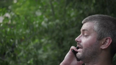 Man talking on the phone for a walk, close up Stock Footage 139760874