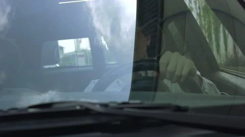 Man talking on the phone while driving Stock Footage 41498224