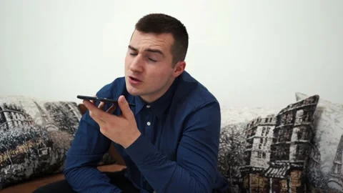Man talking on the phone while sitting in the room Stock Footage 149093029