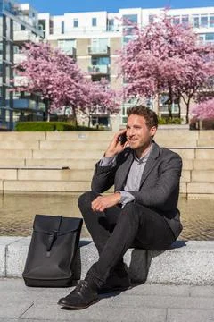 Man talking on smartphone. Businessman urban professional business man using Stock Photos
