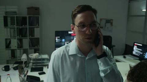 Man Talking on Smartphone in Cyber Security Operations Room Stock Footage 346712753