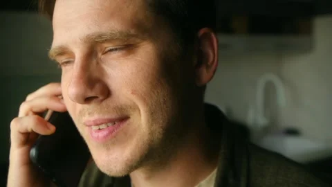 Man talking on smartphone, showing different facial expressions Stock Footage 313642945