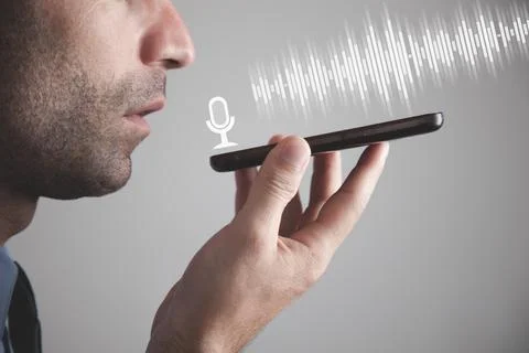 Man talking smartphone using the voice recognition. Stock Photos